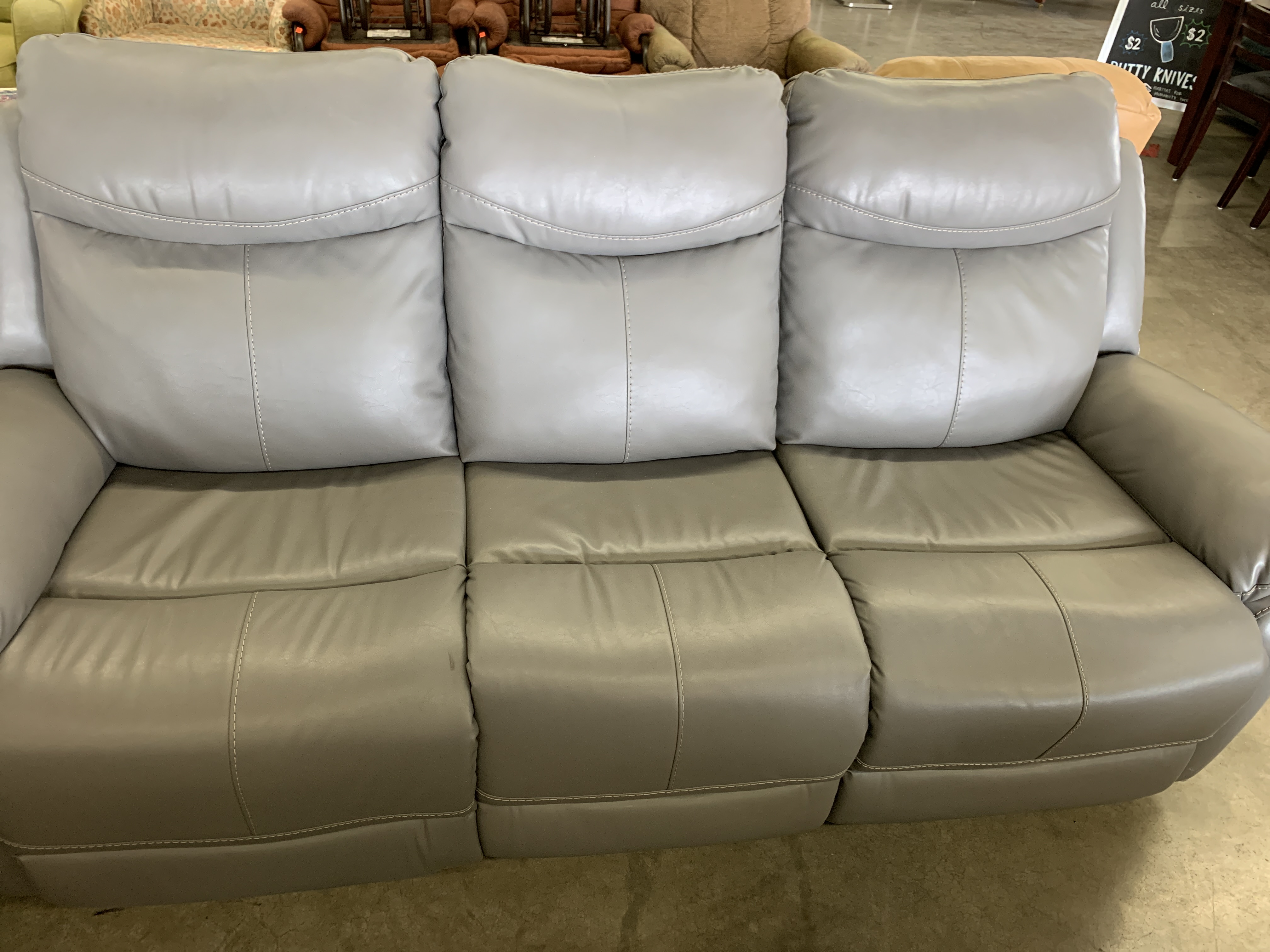 simulated leather sofa meaning
