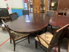 Dark brown table with 5 chairs and 2 leafs